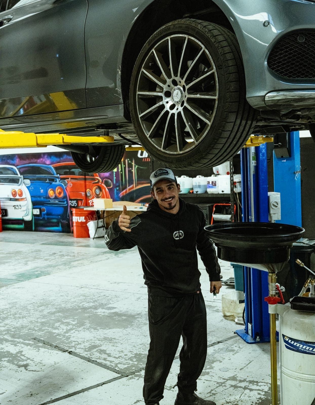A technician at work in the Unorthodox Automotive workshop